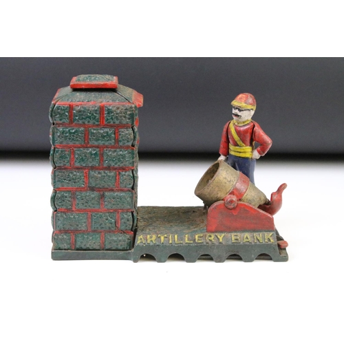 142 - Two reproduction cast iron money boxes to include one Artillery Bank example, and one novelty golfin... 