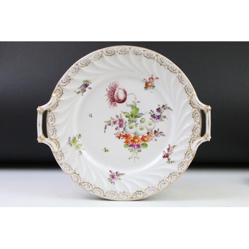 21 - Two Dresden porcelain twin handled plates with hand painted floral decoration and gilt detail to bor... 