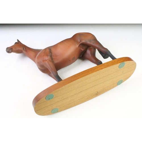 23 - Beswick 'Arkle' connoisseur model racehorse with matt finish, raised on an oblong wooden base, appro... 