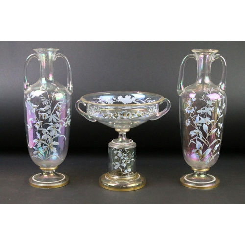 24 - Late 19th / early 20th century iridescent glass three-piece garniture set, with hand painted decorat... 