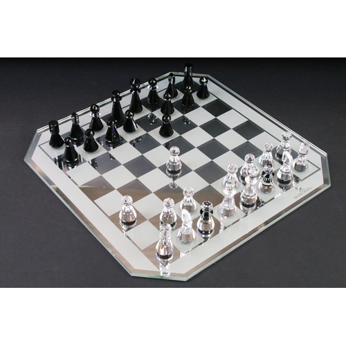 38 - Swarovski Silver Crystal chess set complete with board and 16 pieces, housed within case and outer b... 