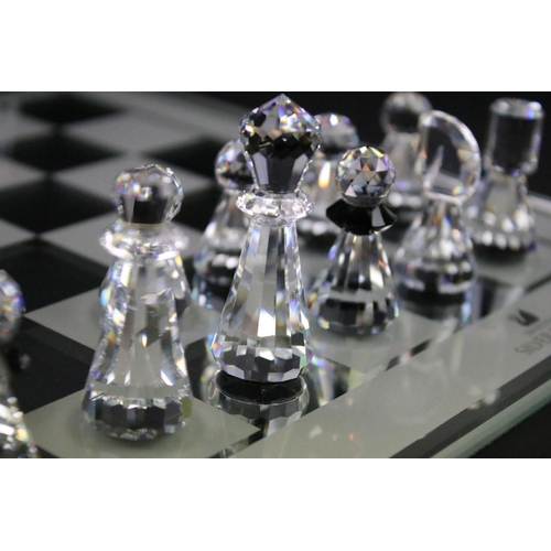 38 - Swarovski Silver Crystal chess set complete with board and 16 pieces, housed within case and outer b... 