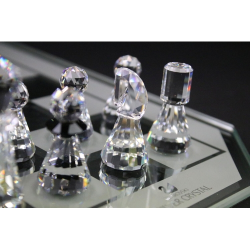 38 - Swarovski Silver Crystal chess set complete with board and 16 pieces, housed within case and outer b... 