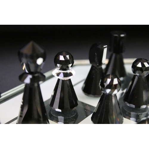 38 - Swarovski Silver Crystal chess set complete with board and 16 pieces, housed within case and outer b... 