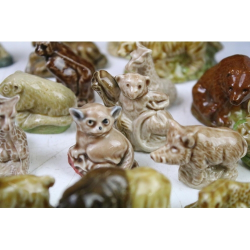 41 - Collection of Wade ceramic animals, mostly Wade Whimsies, also featuring Disney examples