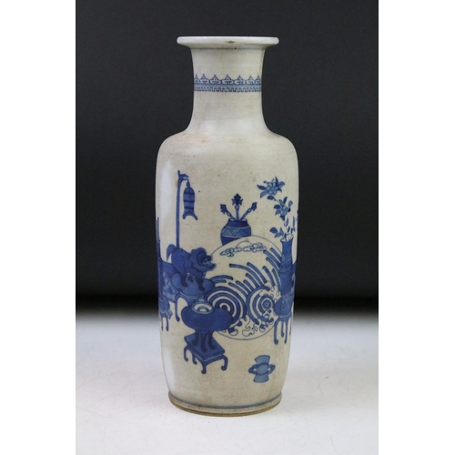 6 - Chinese blue & white baluster vase decorated with a scene with mythical lion, tables & flowers in va... 