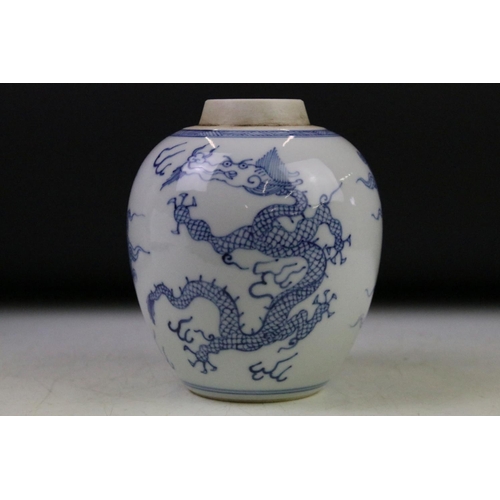 6 - Chinese blue & white baluster vase decorated with a scene with mythical lion, tables & flowers in va... 