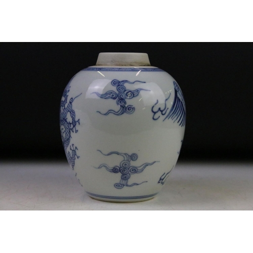 6 - Chinese blue & white baluster vase decorated with a scene with mythical lion, tables & flowers in va... 