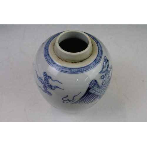 6 - Chinese blue & white baluster vase decorated with a scene with mythical lion, tables & flowers in va... 