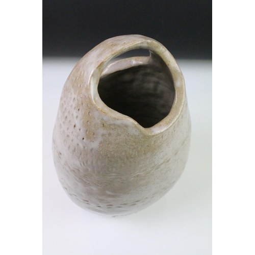 68 - Mid Century 1960s studio art pottery vase or organic form with two openings to top and glazed in whi... 