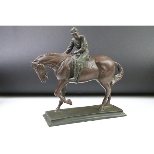 81 - Cast resin horse and jockey figurine marked Cresa 1995, a Beswick lion figurine and a Beswick Burnha... 