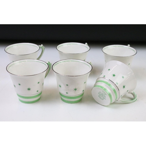 84 - Art Deco Roslyn china coffee set of angular form having a white ground with green star detailing, si... 