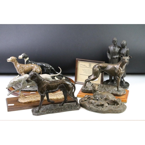 87 - Group of dog figurines to include a Minerva fine Arts resin greyhound, a heredities resin hound, a H... 