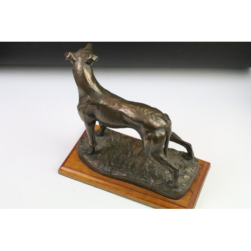 87 - Group of dog figurines to include a Minerva fine Arts resin greyhound, a heredities resin hound, a H... 