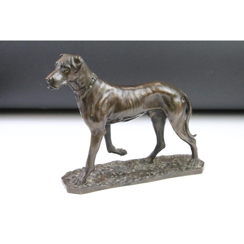 87 - Group of dog figurines to include a Minerva fine Arts resin greyhound, a heredities resin hound, a H... 