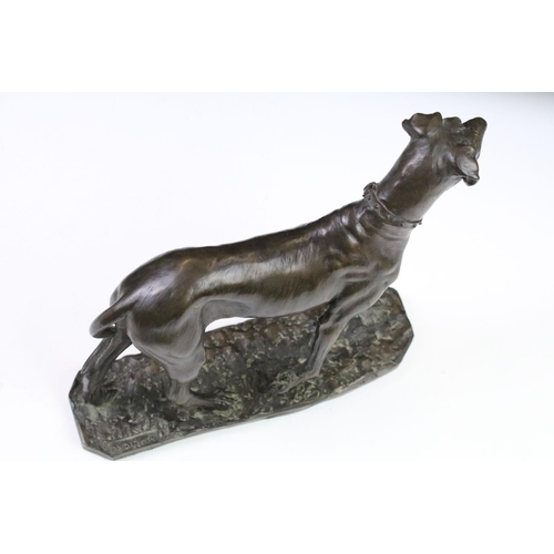 87 - Group of dog figurines to include a Minerva fine Arts resin greyhound, a heredities resin hound, a H... 