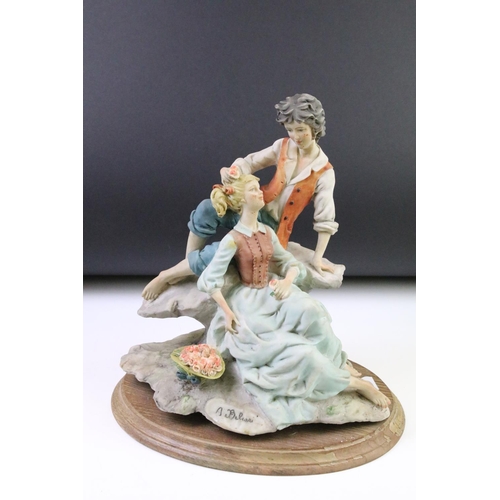 90 - Six Capodimonte porcelain figures / figure groups to include a tramp on a bench, scholar, courting c... 