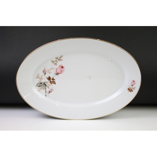 93 - Limoges 'Rose De Monaco' tea & dinner service to include 12 dinner plates, 12 soup bowls, oval platt... 