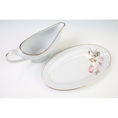 93 - Limoges 'Rose De Monaco' tea & dinner service to include 12 dinner plates, 12 soup bowls, oval platt... 