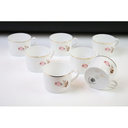 93 - Limoges 'Rose De Monaco' tea & dinner service to include 12 dinner plates, 12 soup bowls, oval platt... 