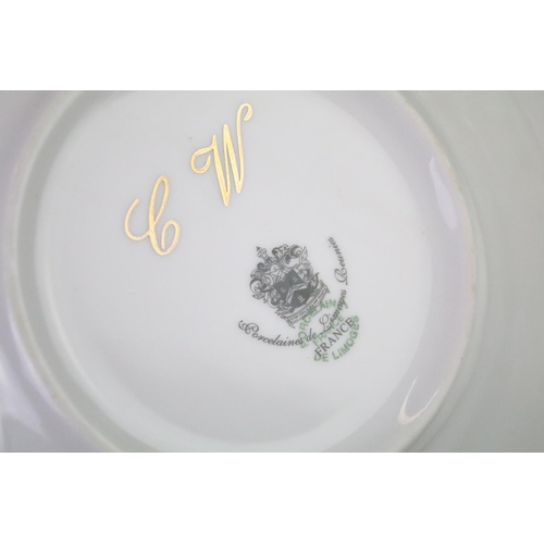 93 - Limoges 'Rose De Monaco' tea & dinner service to include 12 dinner plates, 12 soup bowls, oval platt... 