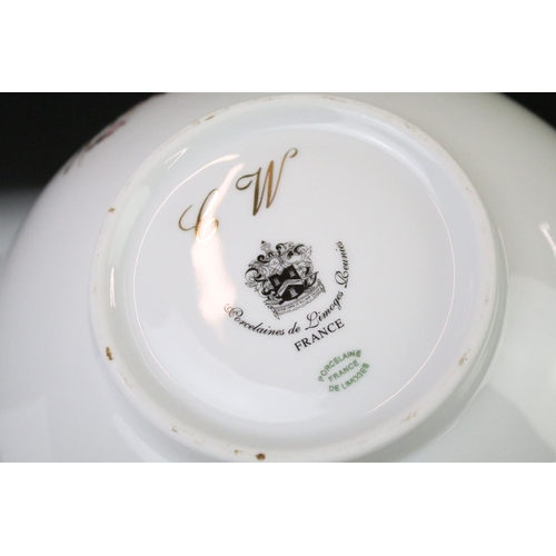 93 - Limoges 'Rose De Monaco' tea & dinner service to include 12 dinner plates, 12 soup bowls, oval platt... 