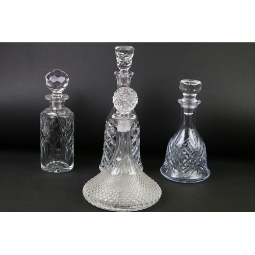 99 - Four moulded / cut glass decanters to include a hobnail effect ships decanter, bell-shaped decanter,... 