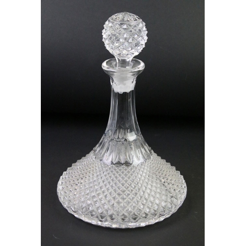 99 - Four moulded / cut glass decanters to include a hobnail effect ships decanter, bell-shaped decanter,... 