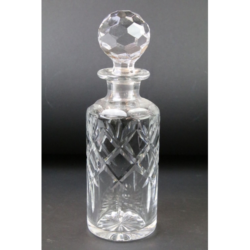 99 - Four moulded / cut glass decanters to include a hobnail effect ships decanter, bell-shaped decanter,... 