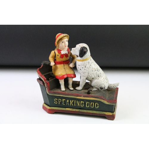 144 - Two reproduction cast iron novelty money boxes to include trick dog and speaking dog. Widest measure... 