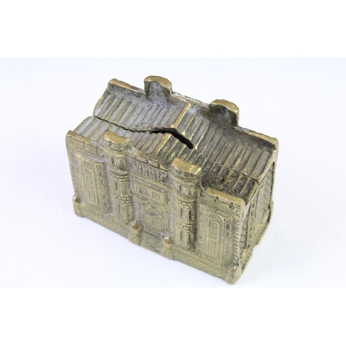 145 - Three cast metal money boxes to include Railroadmen's federal train money bank, cast brass county ba... 