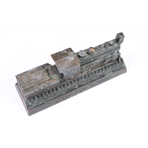 145 - Three cast metal money boxes to include Railroadmen's federal train money bank, cast brass county ba... 