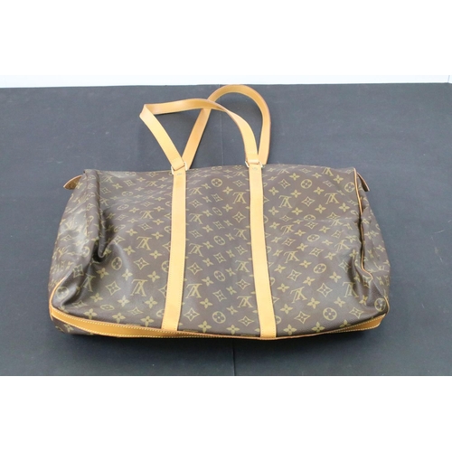 270 - Louis Vuitton - Monogrammed holdall travel bag having tanned leather straps and canvas lined interio... 