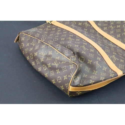 270 - Louis Vuitton - Monogrammed holdall travel bag having tanned leather straps and canvas lined interio... 