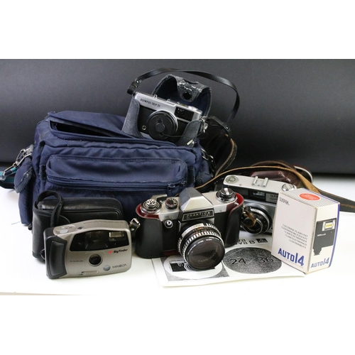 452 - Group of cameras to include an Olympus trip 35 film camera with tripod and camera bag, Praktica PL n... 