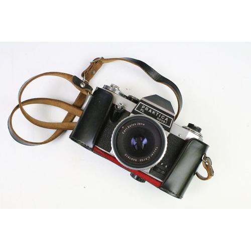 452 - Group of cameras to include an Olympus trip 35 film camera with tripod and camera bag, Praktica PL n... 