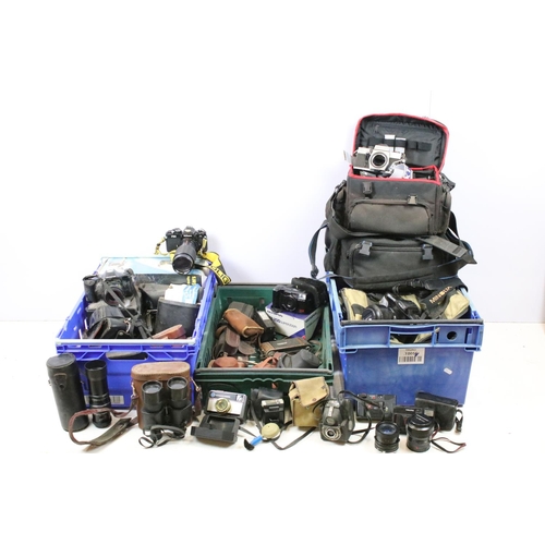 455 - Collection of cameras and associated equipment. The lot to include Nikon FE2 camera with Vivitar 80-... 