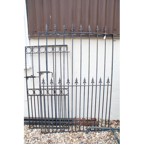 617 - Two wrought iron metal gates, with two gate posts, the larger 170cm high x 115cm wide (including hin... 