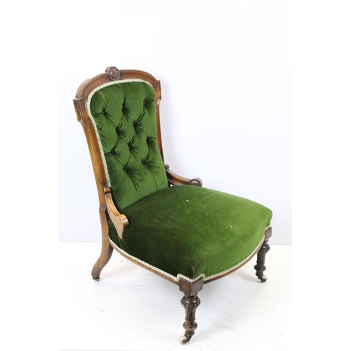 647 - Edwardian nursing chair, with carved back, upholstered in green with button back, on turned legs and... 