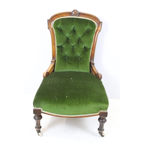647 - Edwardian nursing chair, with carved back, upholstered in green with button back, on turned legs and... 