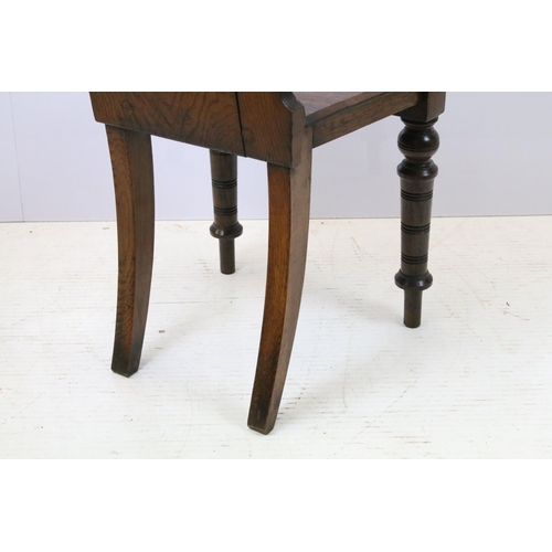 649 - Victorian oak hall chair with Majolica inset tile to back, 90cm high x 44cm wide x 36cm deep