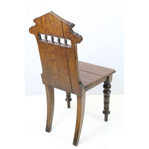 649 - Victorian oak hall chair with Majolica inset tile to back, 90cm high x 44cm wide x 36cm deep