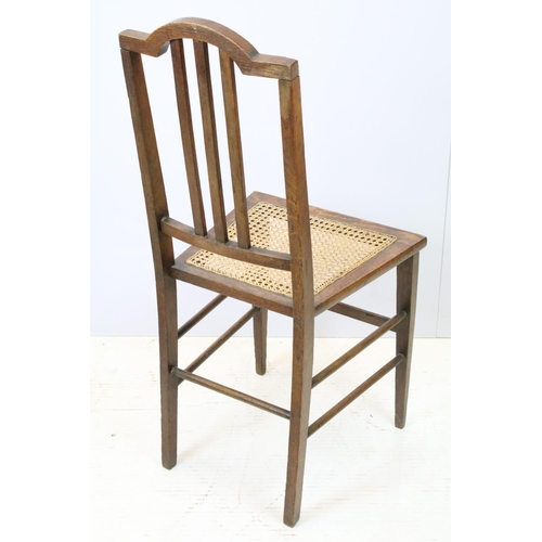 652 - Edwardian low chair, the top rail carved with a flower and foliage, above spindles, the back and sea... 