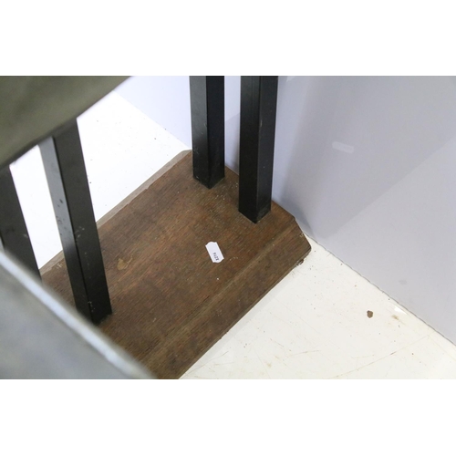 657 - Green leather club fender, the cushioned green leather top above black metal supports and oak base, ... 