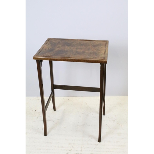 657A - Nest of three walnut coffee tables, the largest, 61cm high x 44cm wide x 33cm deep