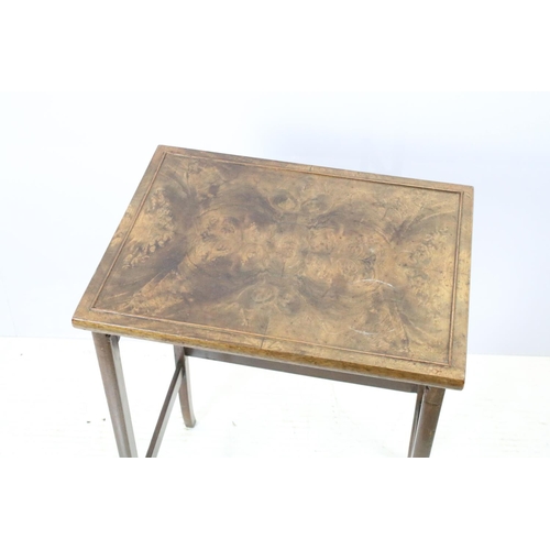 657A - Nest of three walnut coffee tables, the largest, 61cm high x 44cm wide x 33cm deep