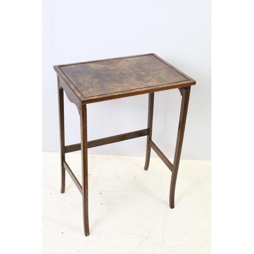 657A - Nest of three walnut coffee tables, the largest, 61cm high x 44cm wide x 33cm deep