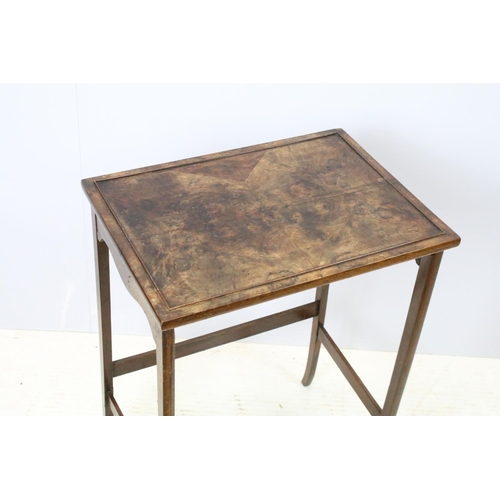 657A - Nest of three walnut coffee tables, the largest, 61cm high x 44cm wide x 33cm deep