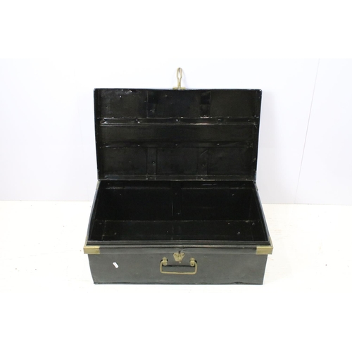 663 - Two large black painted storage trunks with brass fittings