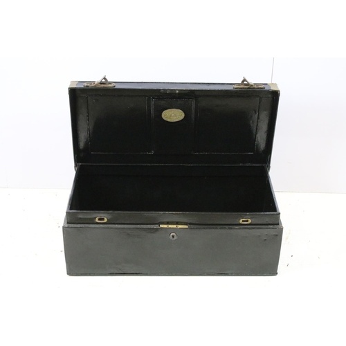 663 - Two large black painted storage trunks with brass fittings